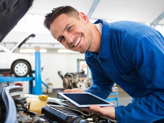 Service Technician Inspecting the Car